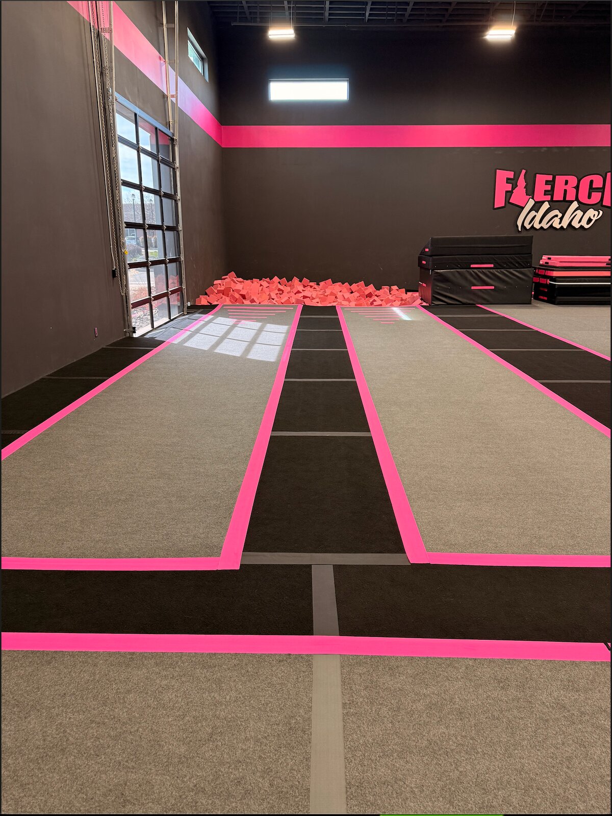 Pink-trimmed rod floor lanes leading to the foam pit
