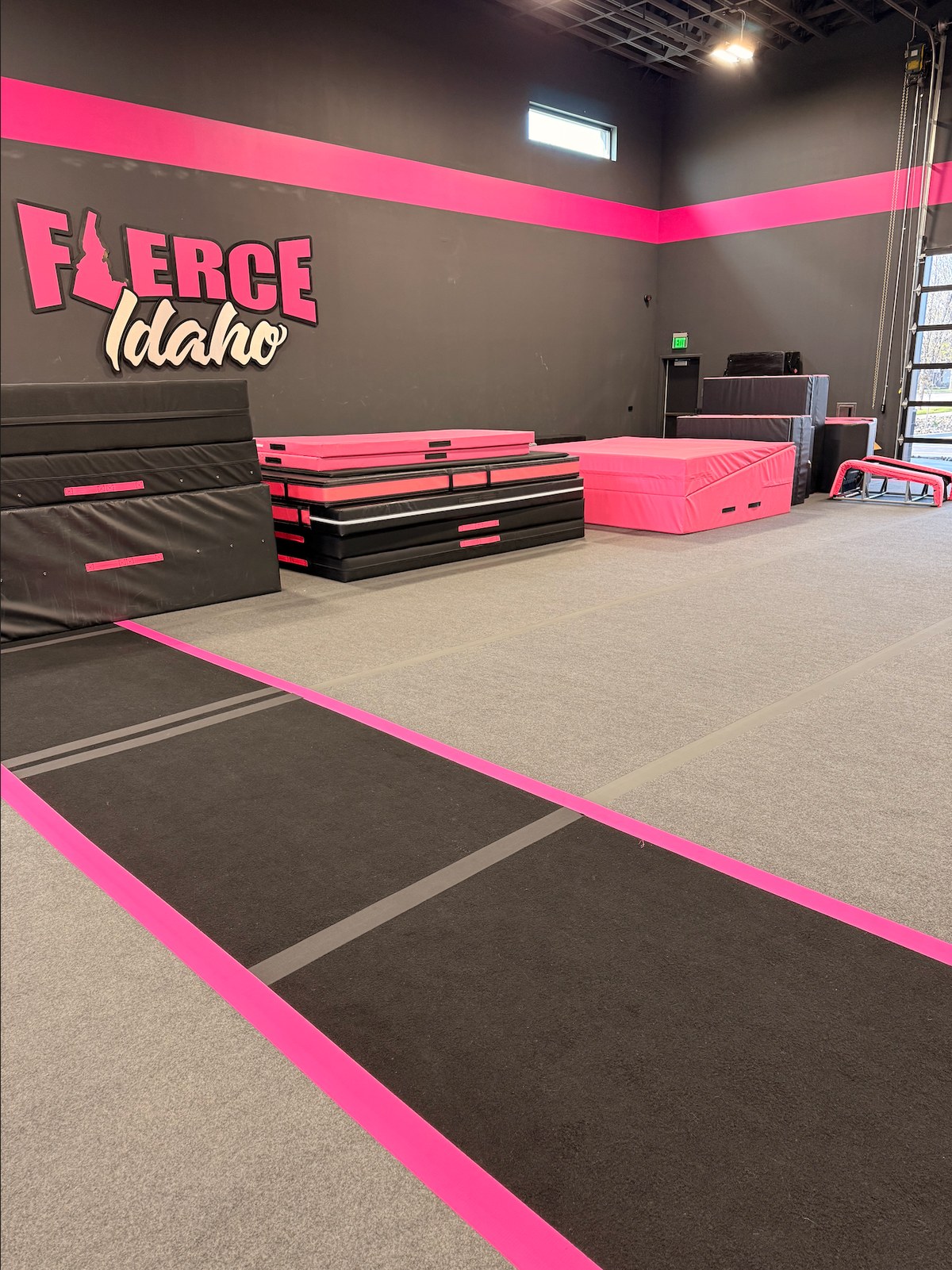 The dedicated tumbling run with pink borders stretching across the Fierce Idaho floor