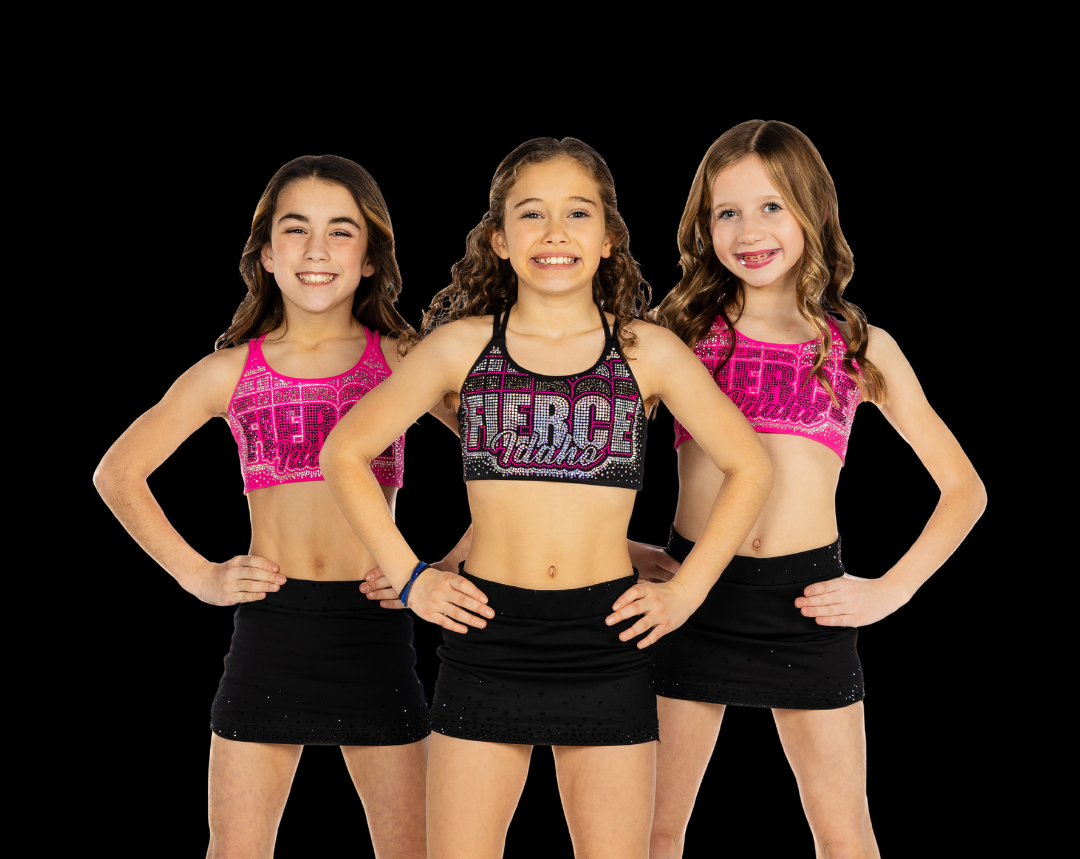 Three Fierce Idaho athletes in rhinestone Fierce Idaho tops standing together with hands on hips