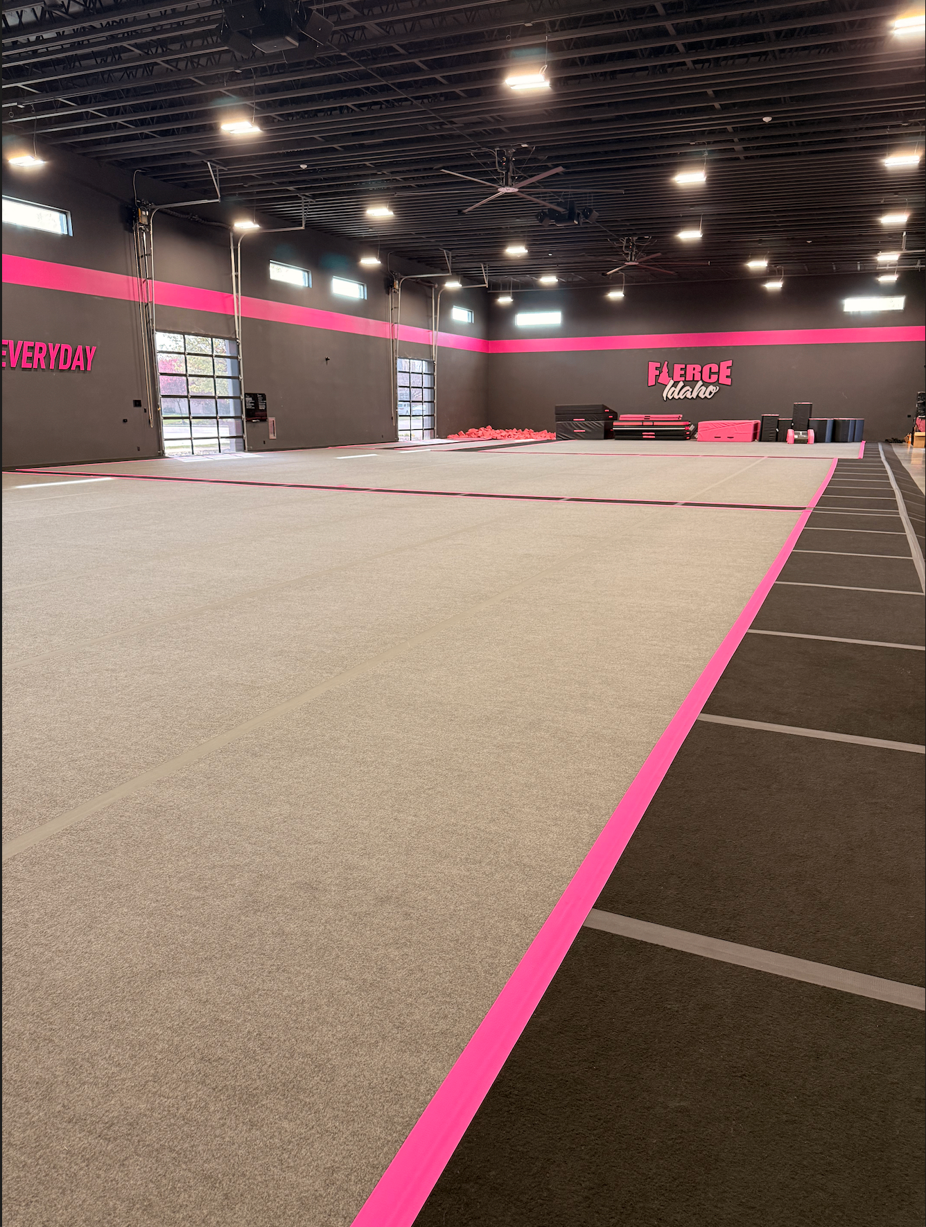 Fierce Idaho's cheer floors with pink-trimmed walls and the Fierce Idaho logo